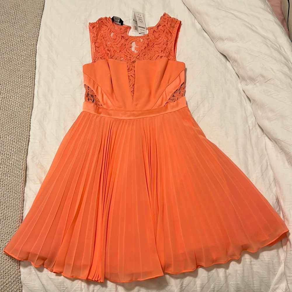 NWT Bebe coral fit and flare pleated lace dress